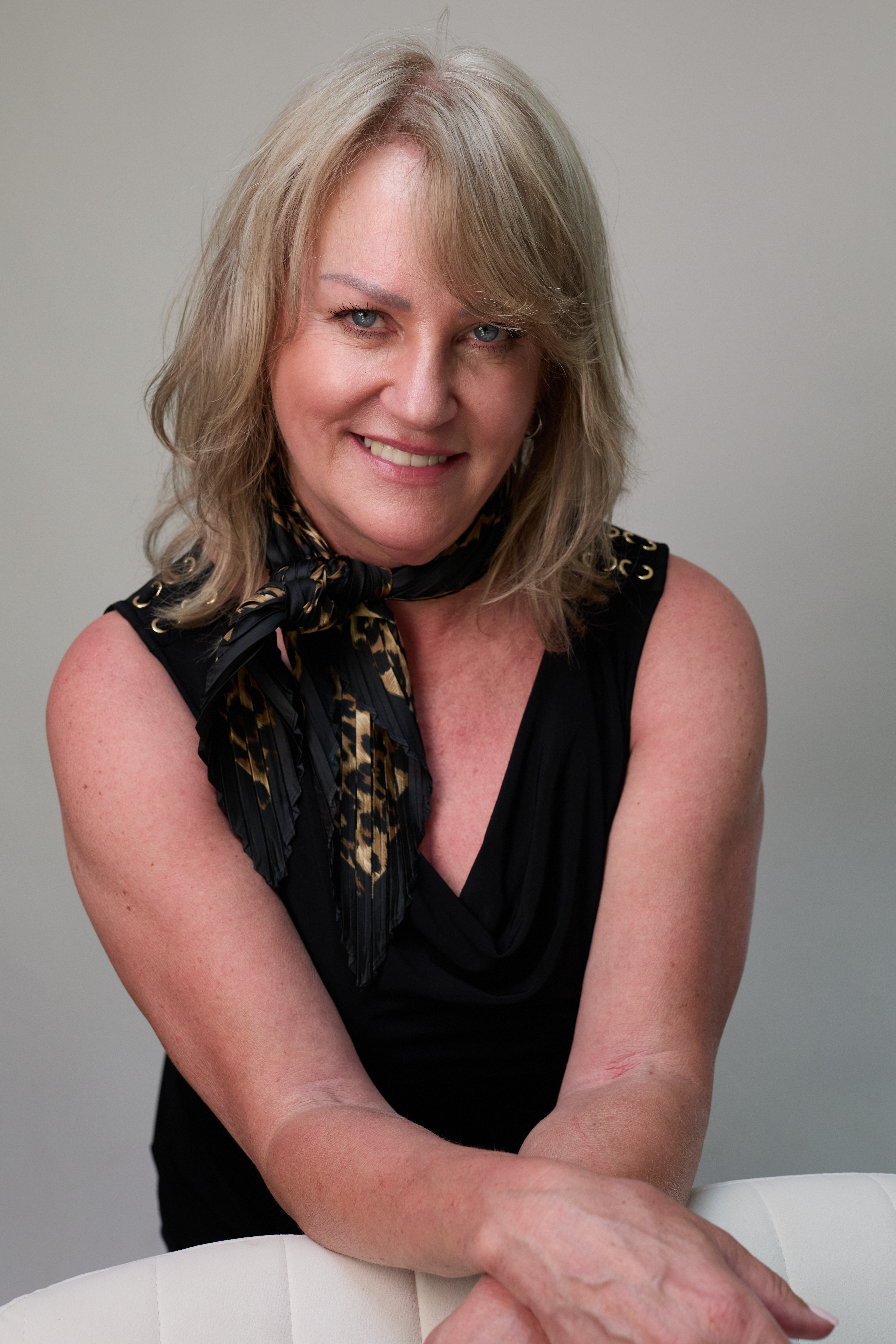 Studio headshot by Polly Sheldon — warm, natural portrait